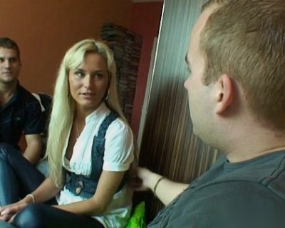 Busty blonde chick on webcam getting fingered by man with black shirt.