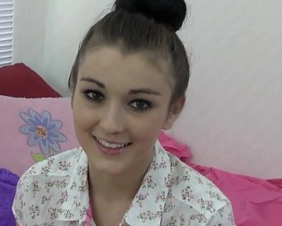 A nervous teen smiles at her first time doing porn