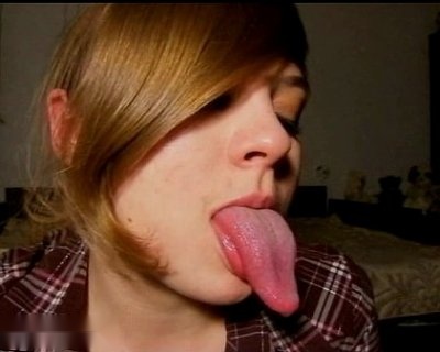 Young slut with blonde hair licking a pink tongue