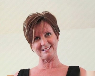 Older whore Smiles at Camera