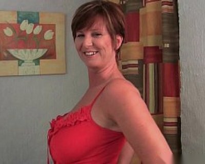 Red-Clad Babe Gives A Smile