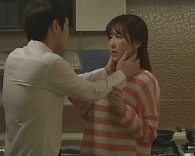 Asian couple interacting with each other in a kitchen setting. Huyhiep12312