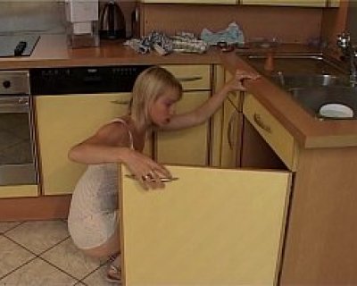 A slut bends over a refrigerator and its door panel. Tanyaofficiel
