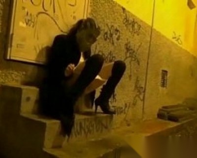 slut wearing heels and black boots sitting on steps. Krakenhot Videos