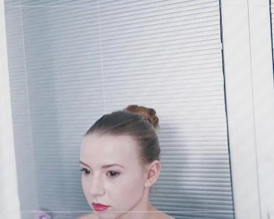 Model poses for castings in front of a mirror.