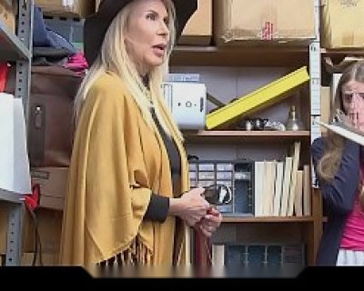 Erica Lauren talks to Officer After in front of a bookcase.