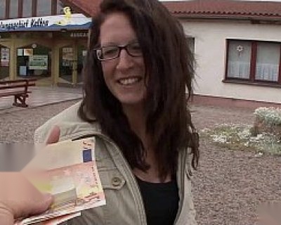German girl holding euros with smile