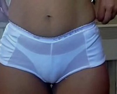 A sluts thighs are wearing a pair of plastic underwear.