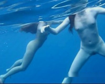 People are swimming and touching each other.