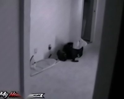 A luggage bag is left behind in a living room.
