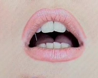 Open mouth of whore with tattoo