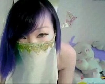 bimbo with blue hair and black outfit covering her face