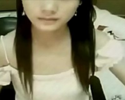 An Asian lady taking selfie of herself