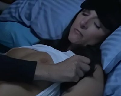 A whore lying in bed with a man trying to comfort her.