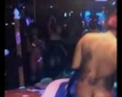 Naked man dancing at a party on the pole.