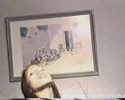 The bimbo is making a funny face. She is also on a video call.