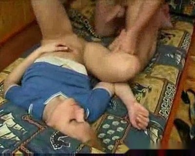 The ass is being fisted. Another pair of muscular hands is also pumping him.