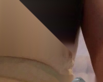 A person's arm wearing a white shirt with Pinas written.
