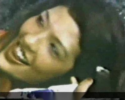 Aki Wang is on the screen. You can see her eyes and her mouth.