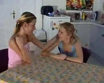 Teen girls chat at breakfast.