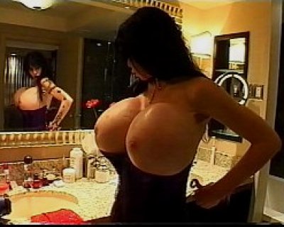 The Biggest. stands in front of a mirror.