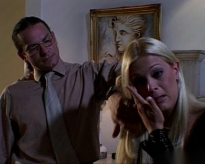 A man puts his hand over a slut wearing black spikes.