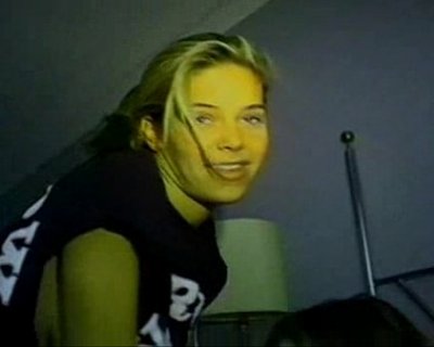 Girl laughing into light. no light in photo