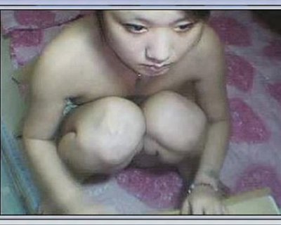 Naked asian bimbo with crossed legs