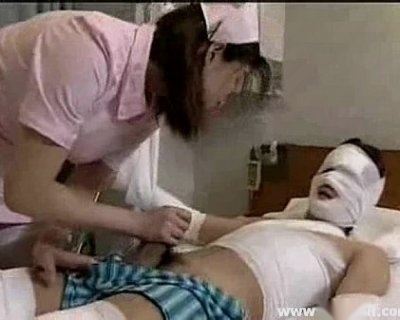 Japanese Nurse Assisting Patient
