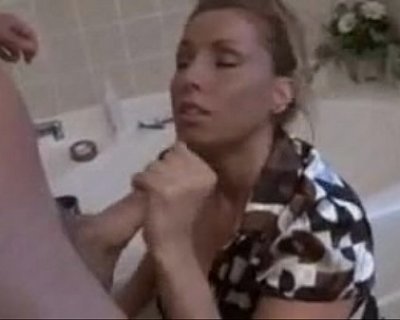 whore is holding her chest. She has her eyes closed.