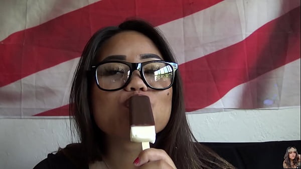 Erotic Goddess ASL Licks Luscious Ice Cream: Tattooed Asian Babe in Glasses Delights with Cleavage and Deaf ASL Charm